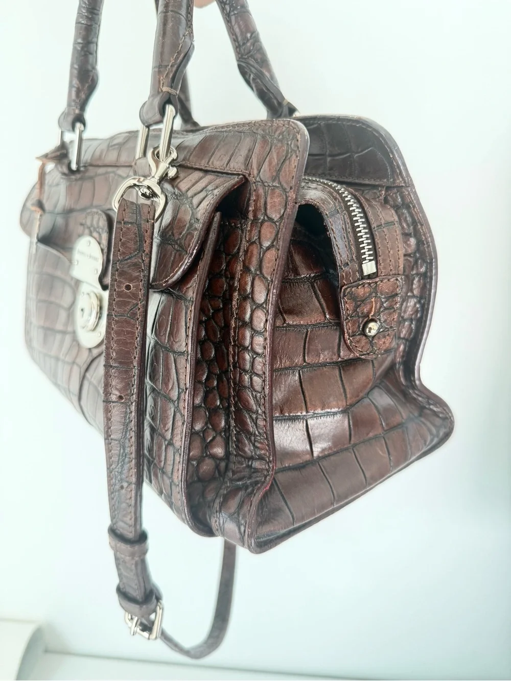 Dooney & Bourke, crafted from rich brown crocodile-embossed leather